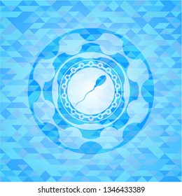 sperm icon inside realistic light blue emblem. Mosaic background