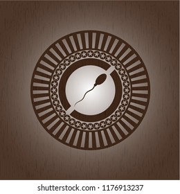 sperm icon inside retro style wooden emblem