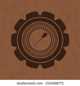 sperm icon inside retro style wood emblem