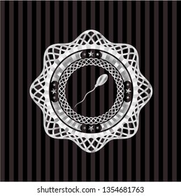 sperm icon inside silvery emblem