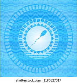 sperm icon inside water wave concept badge.