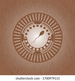 icono de esperma dentro del emblema de madera. Retro