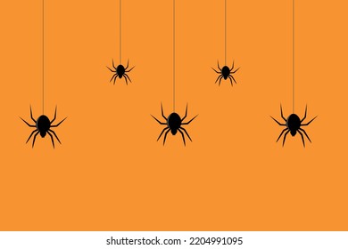 Spider hanging on orange background, for helloween concept