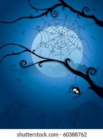 Spider hanging on tree on Halloween night.  Blank space below for design and text.