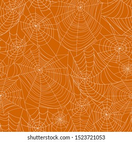 Spider webs on orange background. Seamless pattern. Halloween background