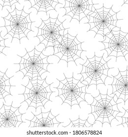 Spider webs seamless pattern. Repetitive vector illustration of black spider web silhouettes on transparent background. EPS 10.