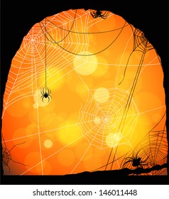 Spiders and web on orange background with space for text