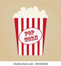 Spilled popcorn on a brow background, cinema, movies and entertainment concept