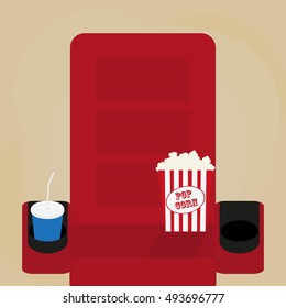 Spilled popcorn on a brow background, cinema, movies and entertainment concept, soda water in glass