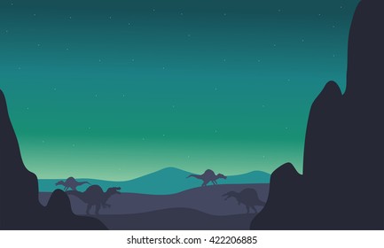 spinosaurus silhouette in hills with green backgrounds