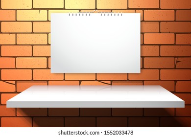 A spiral notebook or calendar hanging on a brick wall over a white empty shelf. Template for design with realistic shadows