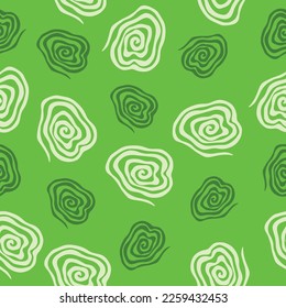 Spirals seamless vector pattern. Vector image on green background