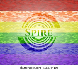 Spire emblem on mosaic background with the colors of the LGBT flag