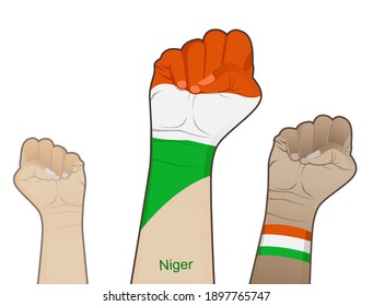 The spirit of struggle by lifting a hand with the Niger flag on it