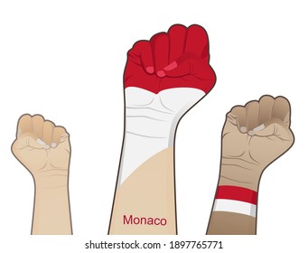 The spirit of struggle by lifting a hand with the Monaco flag on it