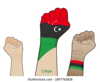 The spirit of struggle by lifting the hand with the Libyan flag on it