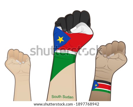 The spirit of struggle by lifting the hands of the South Sudan flag