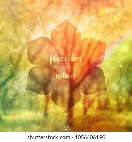 Spiritual illustration with inspirational phrase "freedom is a state of mind"; Sacred geometry on blurred background with forest; Motifs of lotus, flower of life and yantra; Poster for yoga studio.