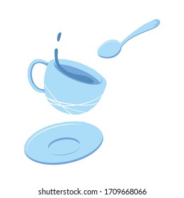 Splash of tea in a mug, saucer and spoon. The concept of teatime