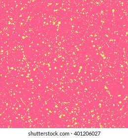 Splash vector seamless pattern. Yellow on pink background hand drawn spray texture. Chaotic yellow spots or specks. Colorful bright abstract background. Festive, birthday texture.