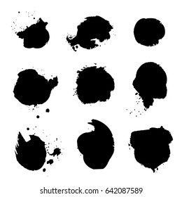Splashes in grunge style. Black vector blots on a white background.