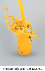 Splashing orange or mango juice on gray background.