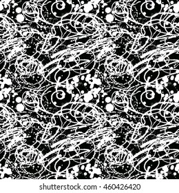 Splattered with dots seamless wallpaper pattern. Hand-drawn sprayed blots painted illustration. Artistic design of ink splashes on the surface. Creative backdrop elements for textile. Grunge texture.
