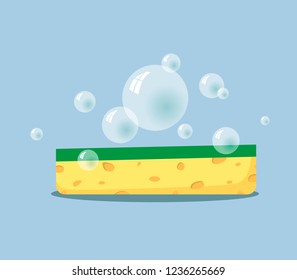 Sponge for washing dishes with soap bubbles on a blue background