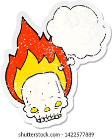 spooky cartoon flaming skull with thought bubble as a distressed worn sticker