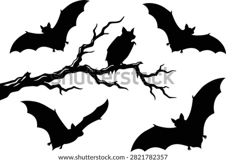 Spooky halloween bats flying around a bare tree branch in a dark artistic silhouette