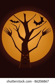 spooky tree with the full moon behind