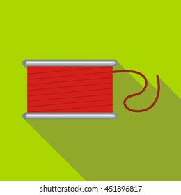 Spool of red thread icon in flat style on a green background