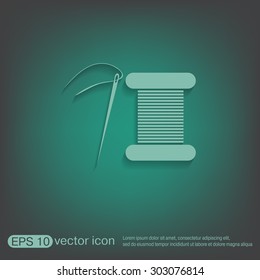 spool of thread and needle. a symbol of fashion and sewing.