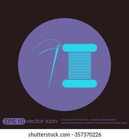 spool of thread and needle. a symbol of fashion and sewing.