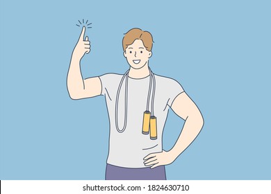 Sport, health, care, advertising, promotion, fitness, training concept. Young happy smiling man boy guy athlete coach character stands with jump rope points finger above. Idea creation illustration.