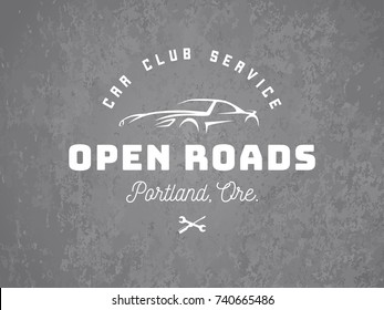 Sports car logo on grunge grey background.
