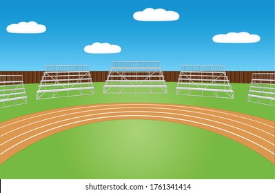 Sports field with running track and empty bleachers