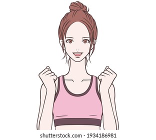 Sports instructor who makes a guts pose with a smile 