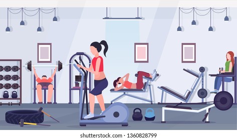 sporty people doing exercises men women working out together on training apparatus in gym workout healthy lifestyle concept modern health club studio interior horizontal