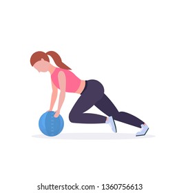 sporty woman doing crossfit exercises with medicine leather ball girl training in gym cardio workout healthy lifestyle concept flat white background full length