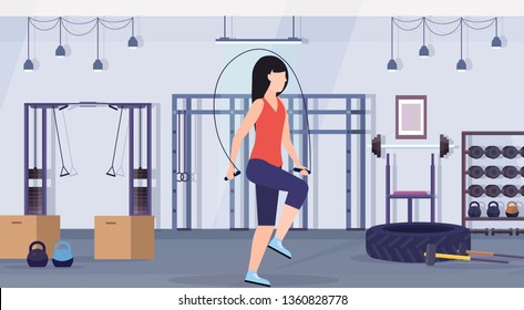 sporty woman doing exercises with jumping rope girl training in gym aerobic workout healthy lifestyle concept flat modern health club studio interior horizontal