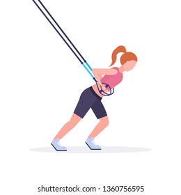 sporty woman doing exercises with suspension fitness straps elastic rope girl training in gym crossfit cardio workout healthy lifestyle concept flat white background full length