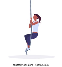 sporty woman doing rope climbing exercise african american girl training in gym cardio crossfit workout healthy lifestyle concept flat white background full length