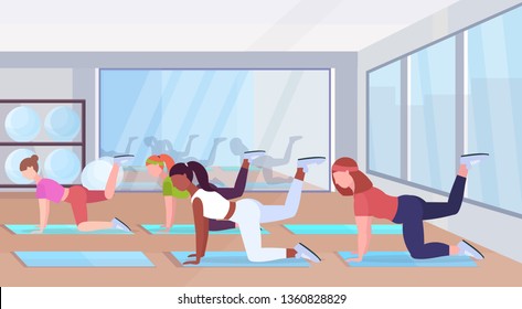 sporty women doing fitness exercises on yoga mat mix race girls training in gym workout healthy lifestyle concept flat modern health club studio interior horizontal