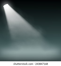 Spotlight illuminates smoke on a dark background