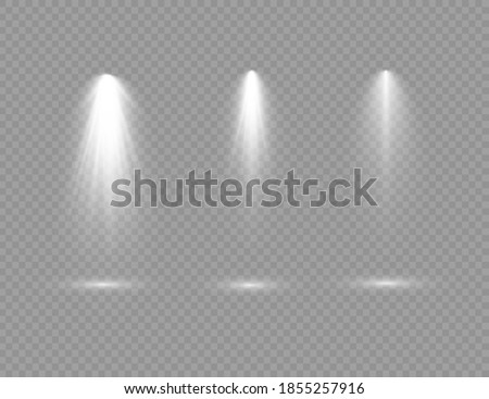 The spotlight shines on the stage. light exclusive use lens flash light effect. light from a lamp or spotlight. lighted scene. podium under the spotlight.