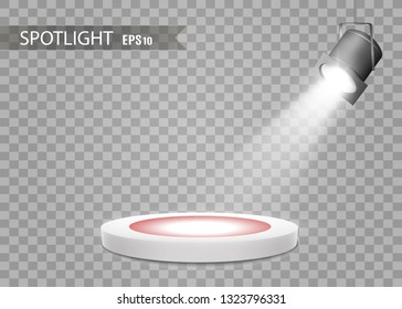 The spotlight shines on the stage.Llight from a lamp or spotlight. Lighted scene. Podium under the spotlight.
