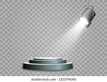 The spotlight shines on the stage.Llight from a lamp or spotlight. Lighted scene. Podium under the spotlight.
