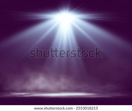 Spotlights shining down in a dark, misty atmosphere, creating a dramatic stage or stadium effect with beams of light piercing through the haze. Ideal for themes related to performances, events.	