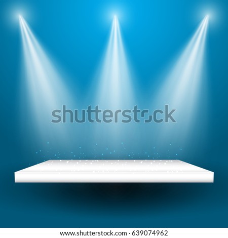 Spotlights shining down onto an empty display shelf